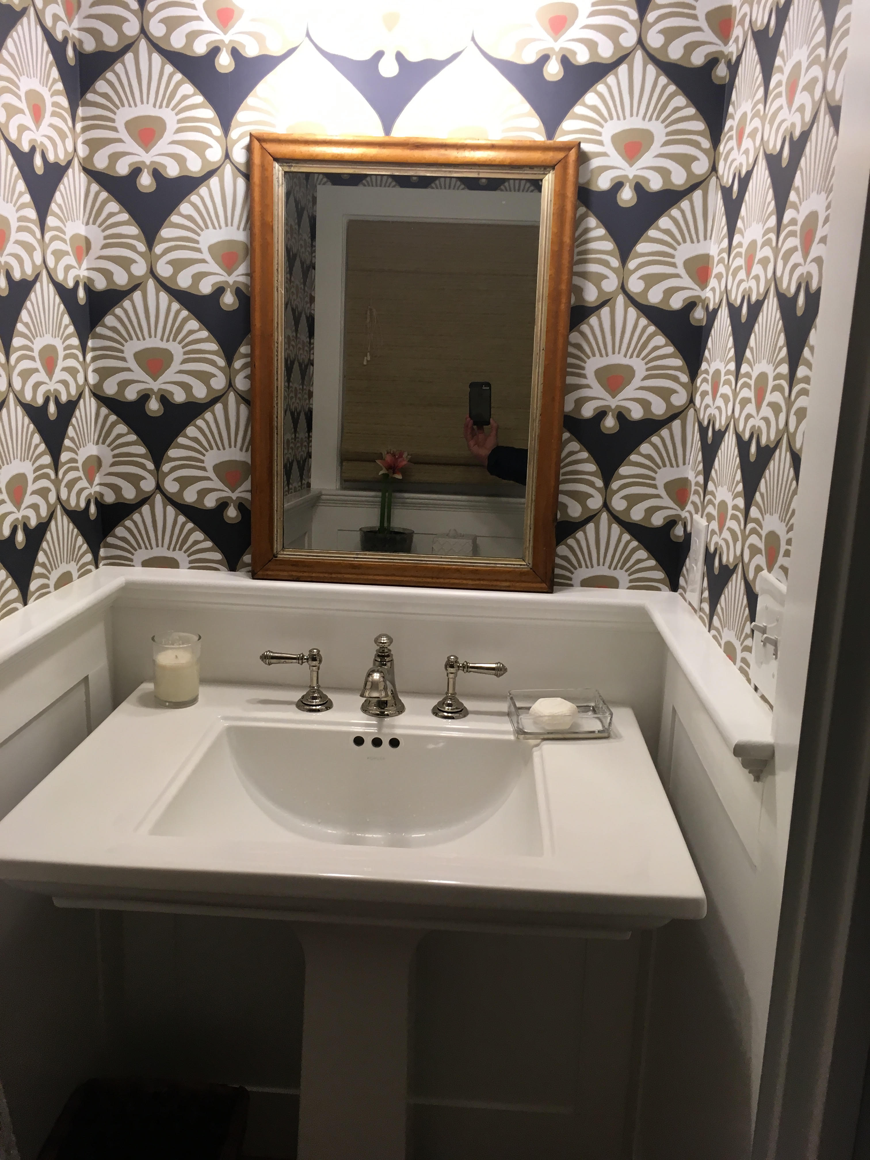 bathroom sink with spade wallpaper
